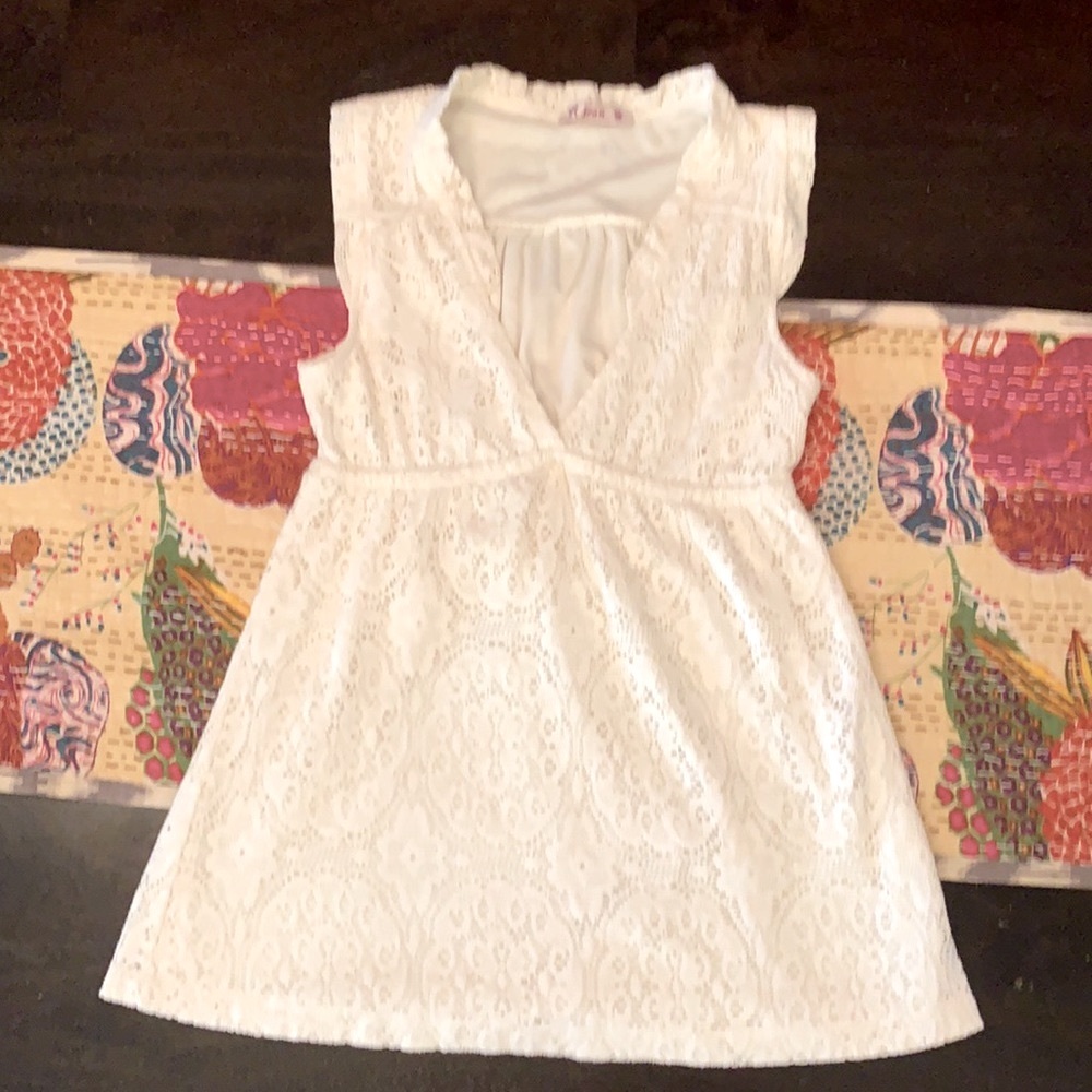 R Jean white sleeveless babydoll crochet top